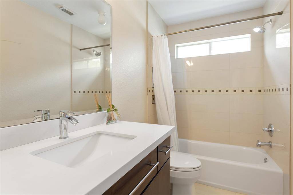 Second-floor full bathroom adds convenience and style.