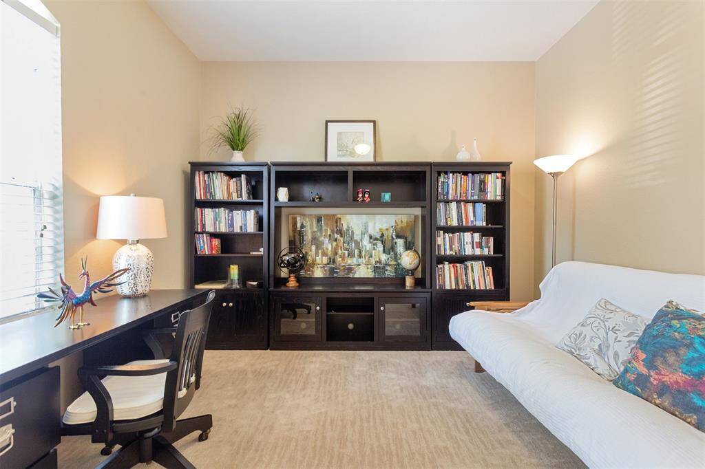 Spacious fourth bedroom with ample natural light, ideal for a home office or guest room.