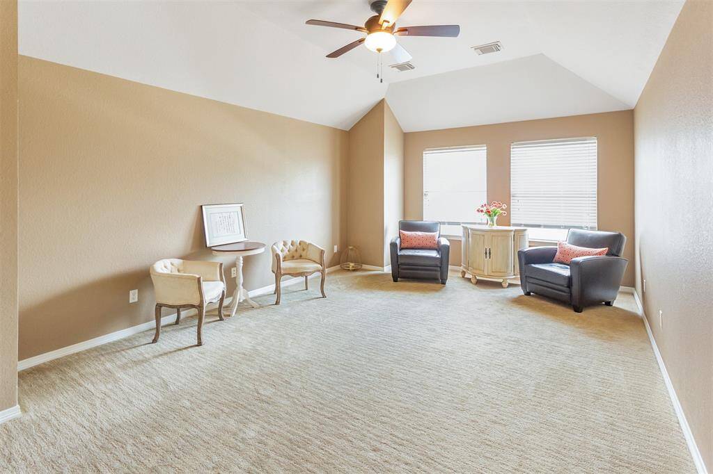 Spacious game or media room perfect for family gatherings.