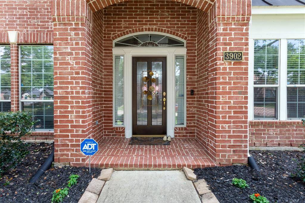 Warm and inviting red brick foyer, offering a serene welcome home.