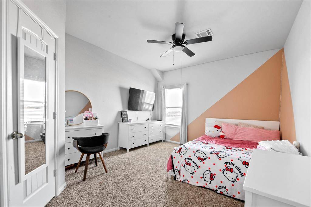 The secondary bedrooms are light and airy, offering a comfortable and inviting atmosphere. Each room features a spacious walk-in closet, providing plenty of storage and organization options.