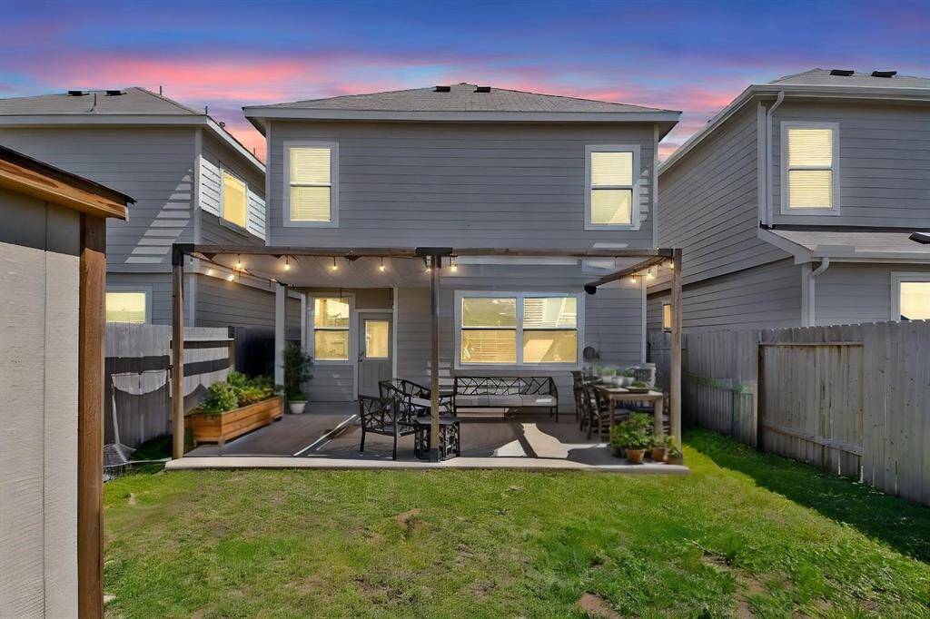 The comfortably sized backyard offers a private retreat with an extended covered patio and a charming pergola, perfect for outdoor dining or relaxation. With no back neighbors, for an added sense of seclusion and tranquility.