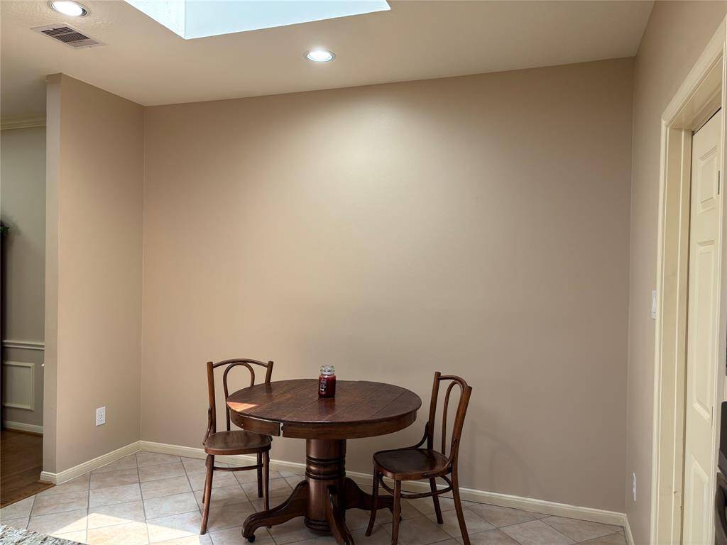 Bright breakfast nook with a skylight for natural light.
