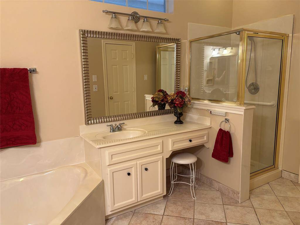 The primary bath includes a vanity and separate shower.