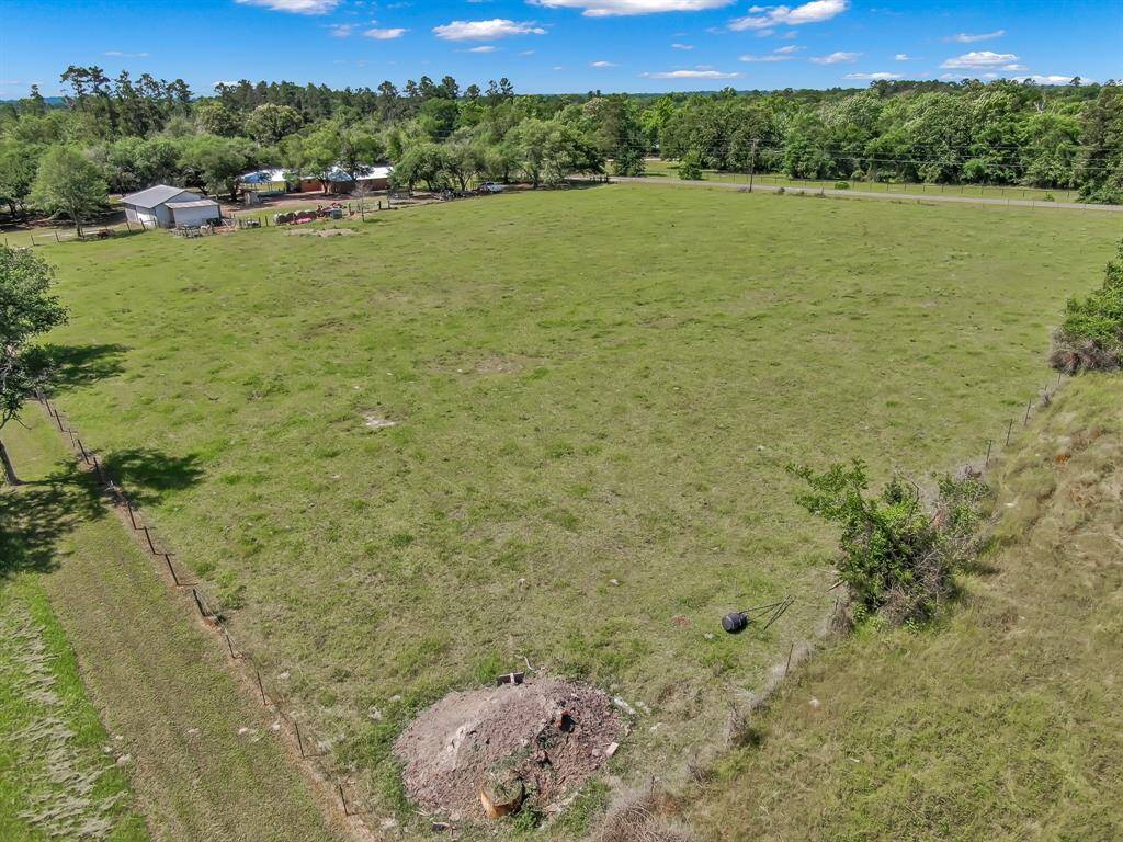 Expansive pasture with a fenced perimeter to welcome your livestock