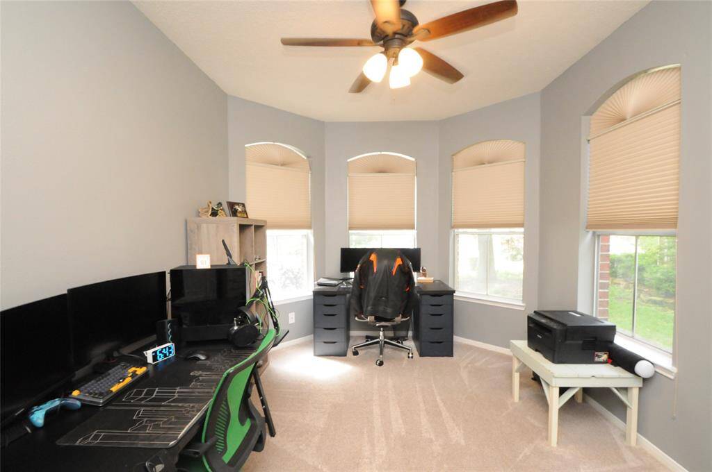 Secondary bedroom at the front of the home is currently being used as an office