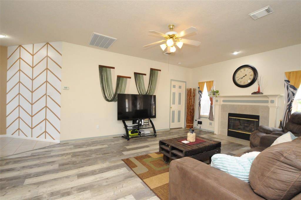 Door beyond the family room leads to the primary suite