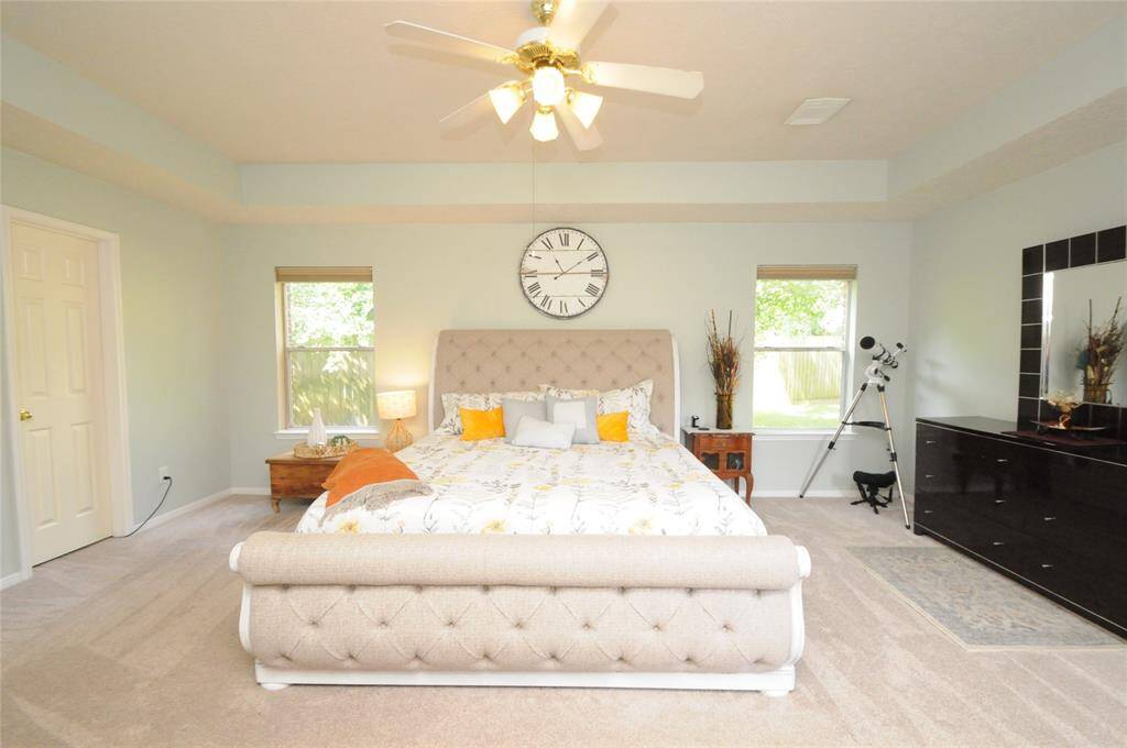 This amazing primary can easily accommodate all of your large bedroom furniture