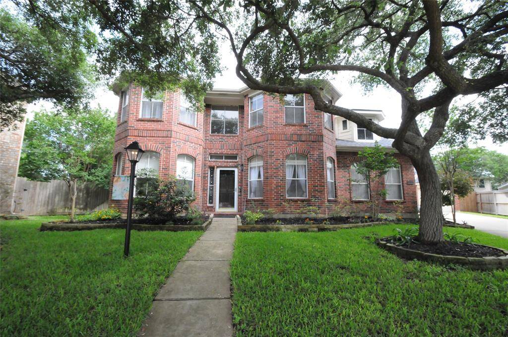 This stately red brick home is situated on a large cul de sac lot on a small quiet street
