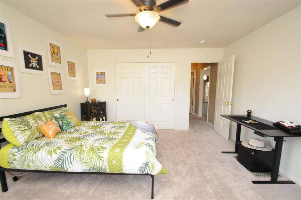 Another view of this secondary bedroom with double sliding door closet