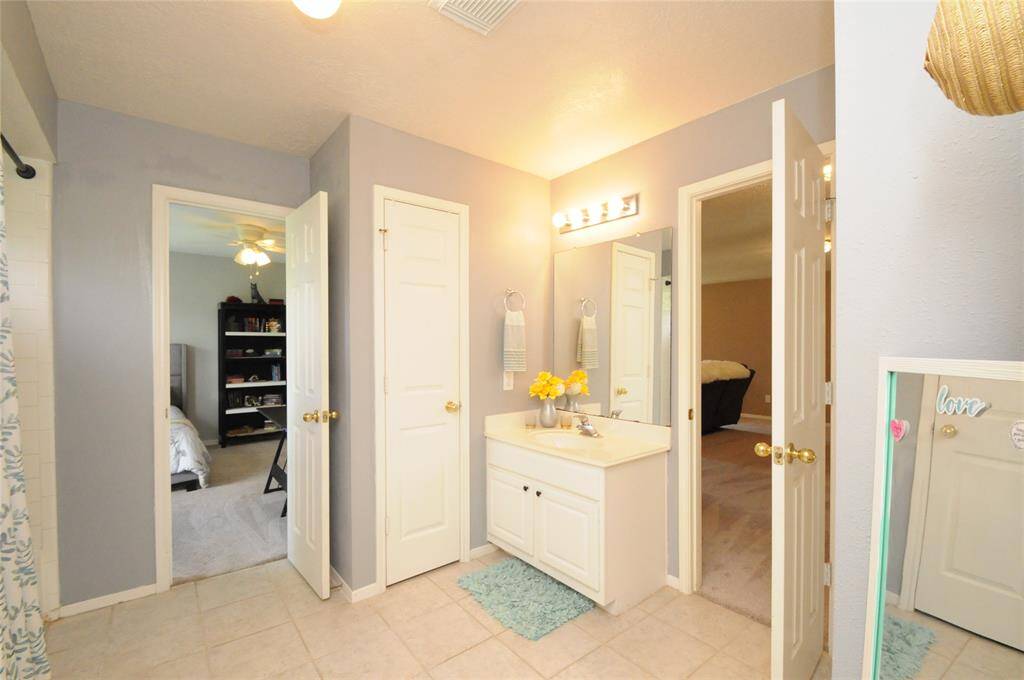 This bath connects to one of the secondary bedrooms and is also accessible from the game room