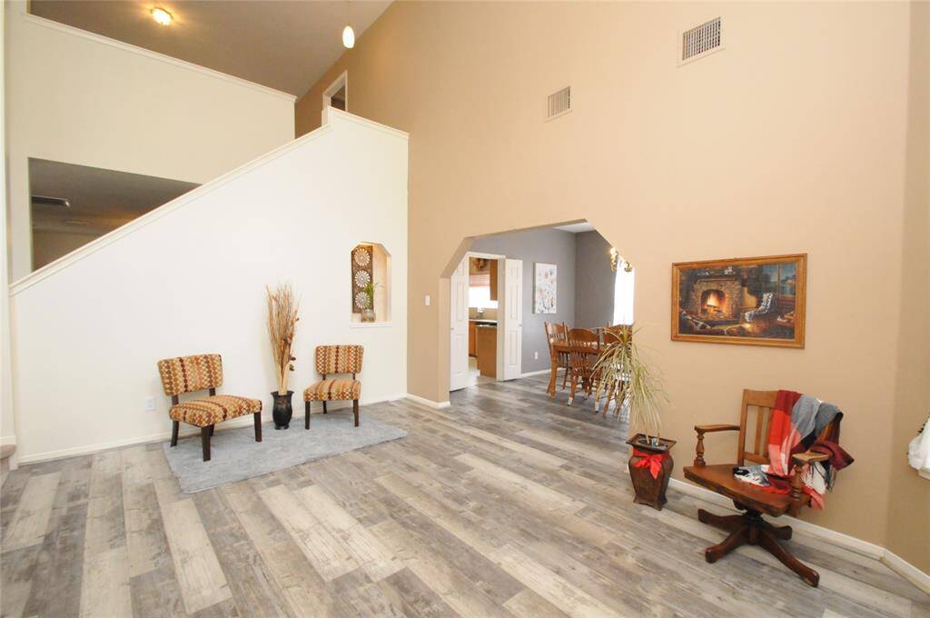 The sitting area flows perfectly into the formal dining room