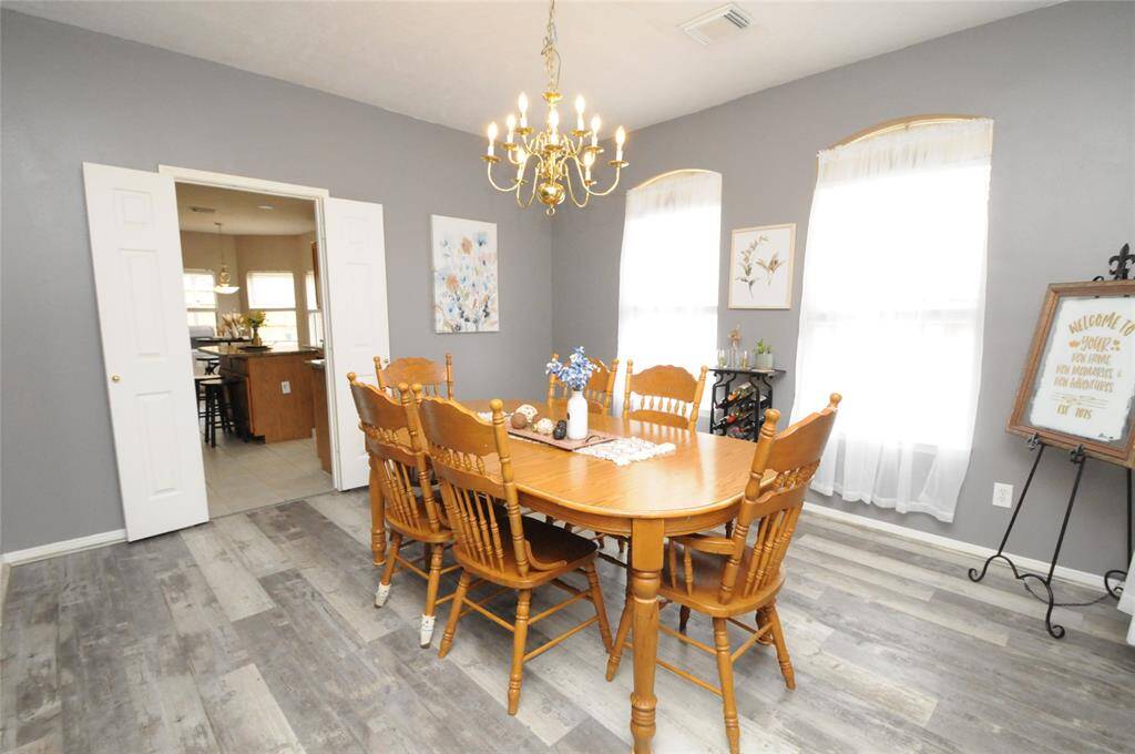 The dining area opens up directly into the kitchen, creating an effortless flow between the spaces