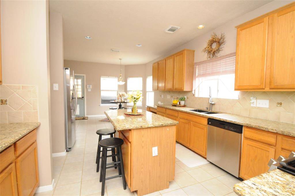The well appointed kitchen offers plenty of cabinet and counter space