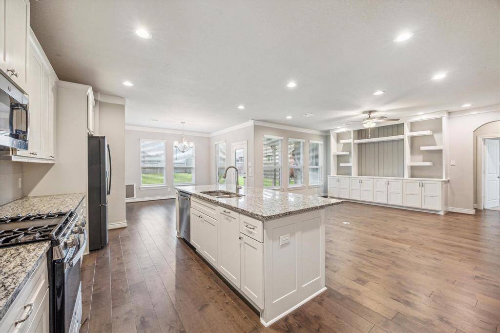 Spacious kitchen seamlessly flows into the bright living area, perfect for entertaining.