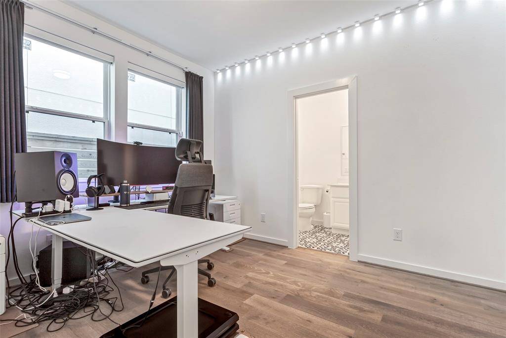 This versatile main-level bedroom offers endless possibilities—perfect as a guest suite, home office, playroom, or whatever you need it to be.