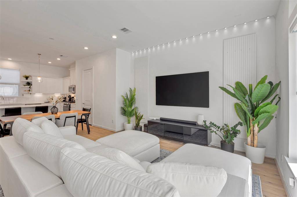 Welcome to the second floor! From this corner of the living room, enjoy a clear view of the dining area and kitchen—thanks to the open layout that seamlessly connects each space.