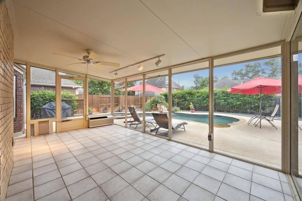 THIS SUN ROOM OFFERS LOTS OF OPTIONS FOR CHOICES OF ENTERTAINMENT AND RECREATIONAL FURNITURE