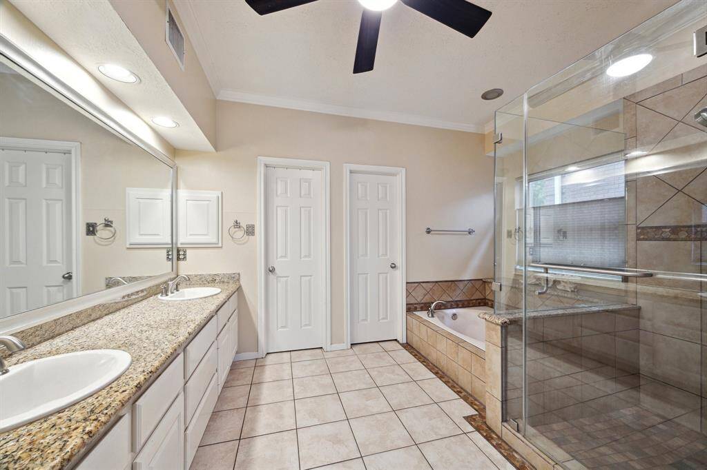 PRIMARY LUXURIOUS BATH OFFERS DUAL SINKS AND VANITY AREA, 2 WALK-IN CLOSETS AND JETTED TUB