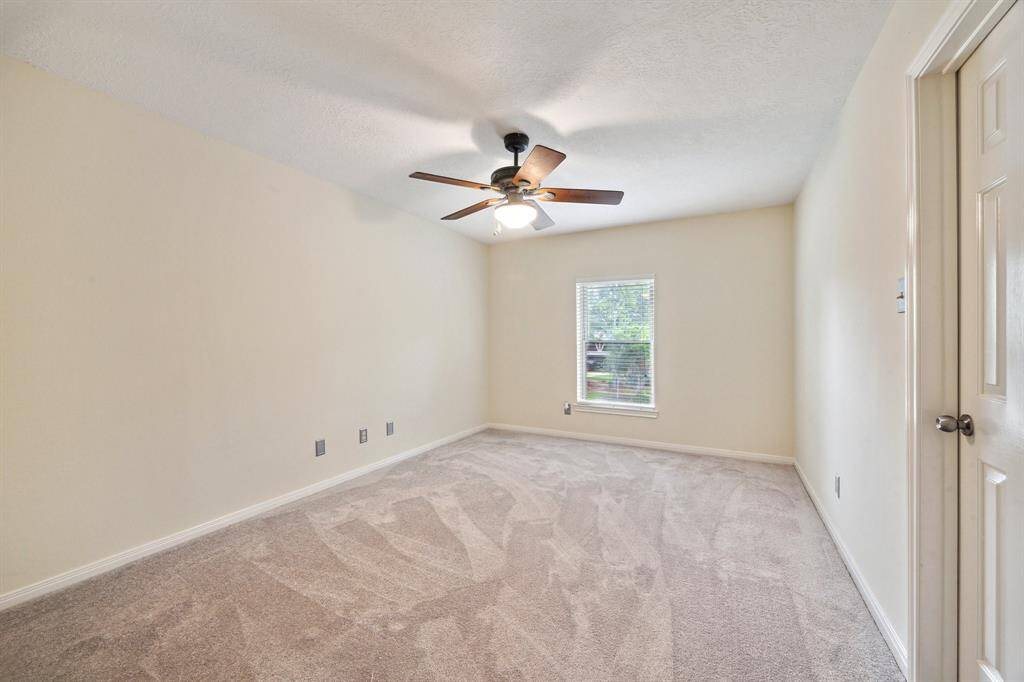 3RD BEDROOM OFFERS A WALK-IN CLOSET, NEW CARPET AND CEILING FAN