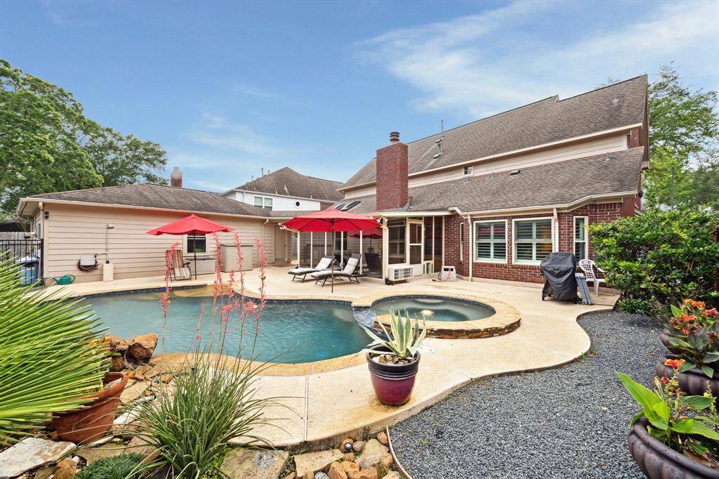 BEAUTIFULLY LANDSCAPED WITH DECORATIVE GRAVEL MAKES A CLEAN LOOK THROUGOUT