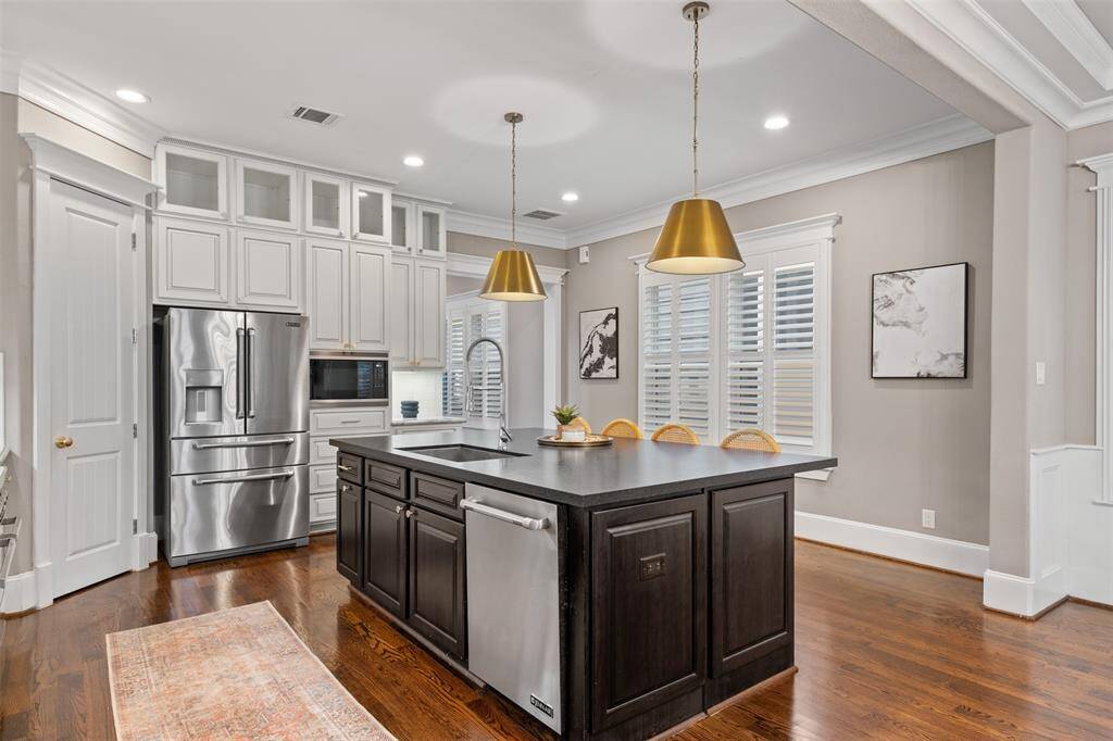 Cook, host, and connect in a thoughtfully designed kitchen outfitted with premium appliances and timeless finishes.