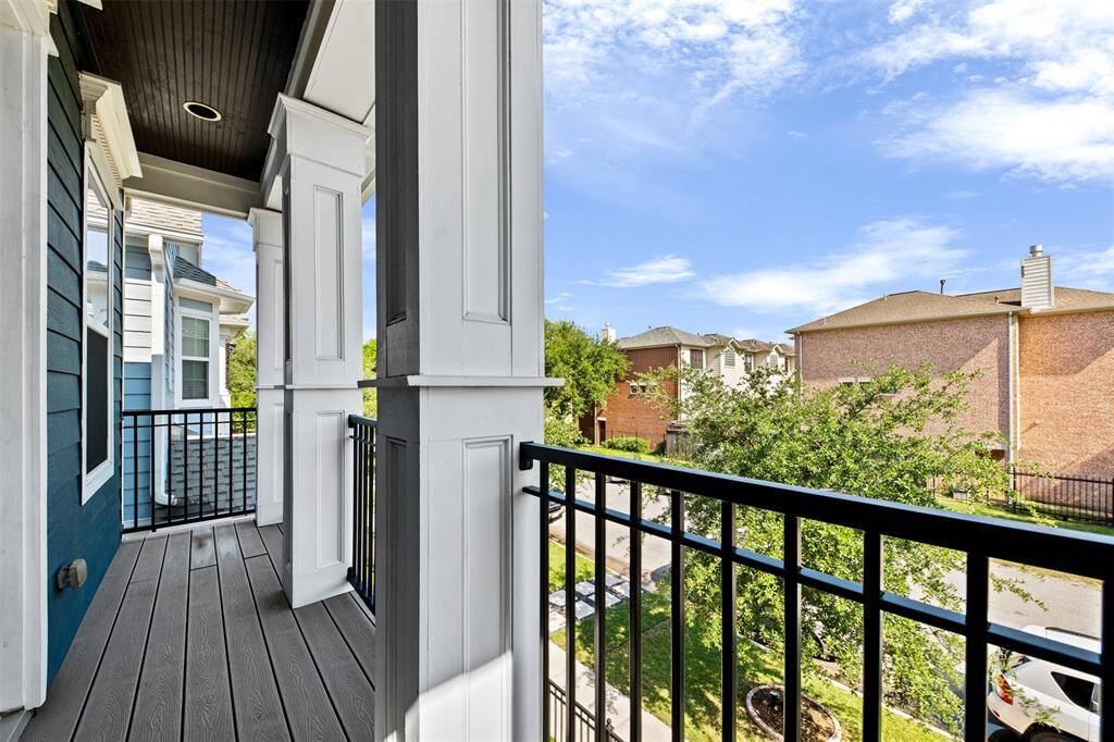 Step out onto the upstairs balcony — a peaceful spot to enjoy morning coffee, evening breezes, or views of the charming tree-lined street.