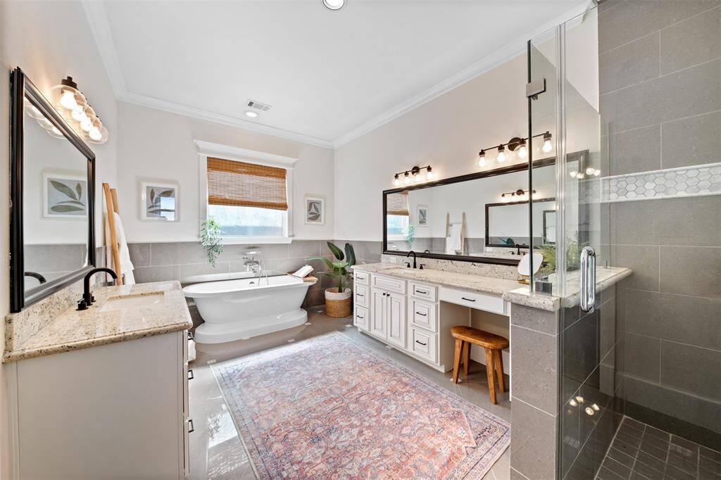 Relax and unwind in style — the luxurious ensuite bath features a separate soaking tub, spacious shower, and elegant finishes throughout.
