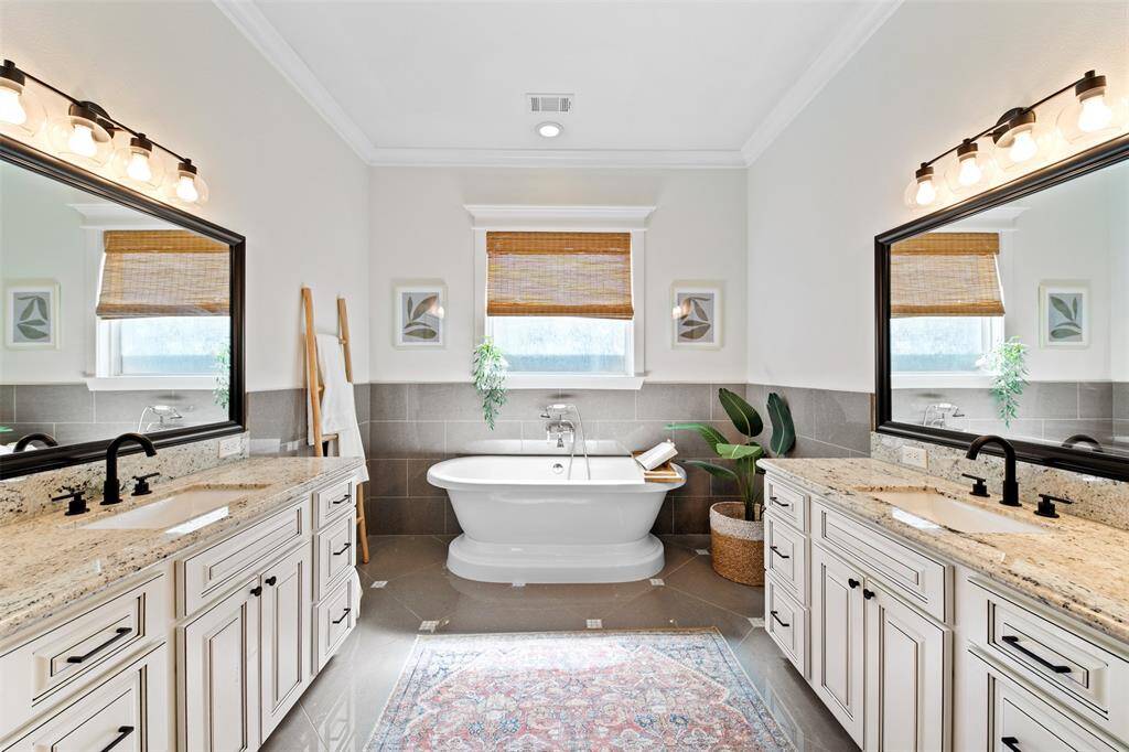 A true retreat, the primary bath offers a freestanding tub and separate shower, providing the perfect balance of luxury and convenience.”