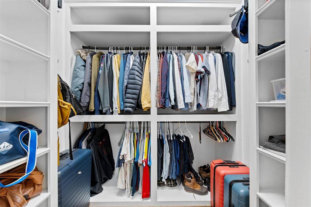A true masterpiece of organization — the spacious walk-in closet in the primary suite combines functionality and style for the ultimate closet experience.