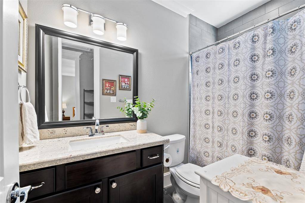 Designed for comfort and style, the secondary bathrooms feature modern fixtures, elegant tile work, and thoughtful details for everyday convenience.
