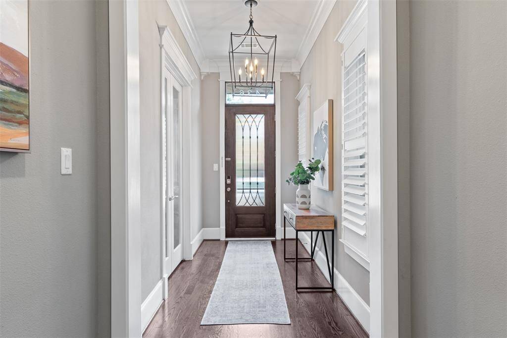 From floor to ceiling, every detail shines — elegant moldings, tall ceilings, and timeless hardwoods set the tone for elevated living.