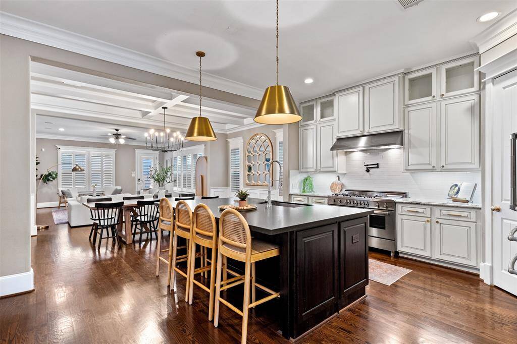 Open-concept design seamlessly connects the kitchen to the living and dining areas, creating a warm, inviting space for everyday life and gatherings.