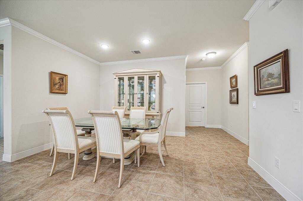 Spacious dining area perfect for hosting with room for a large table and serving pieces.