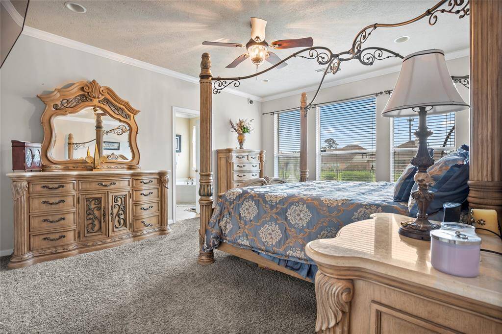 Wake up to serene, panoramic views in this expansive primary bedroom retreat, where comfort meets luxury.