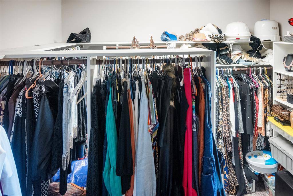 A clothing lover’s dream—this expansive primary closet features custom shelving, a dedicated shoe nook, and space to spare