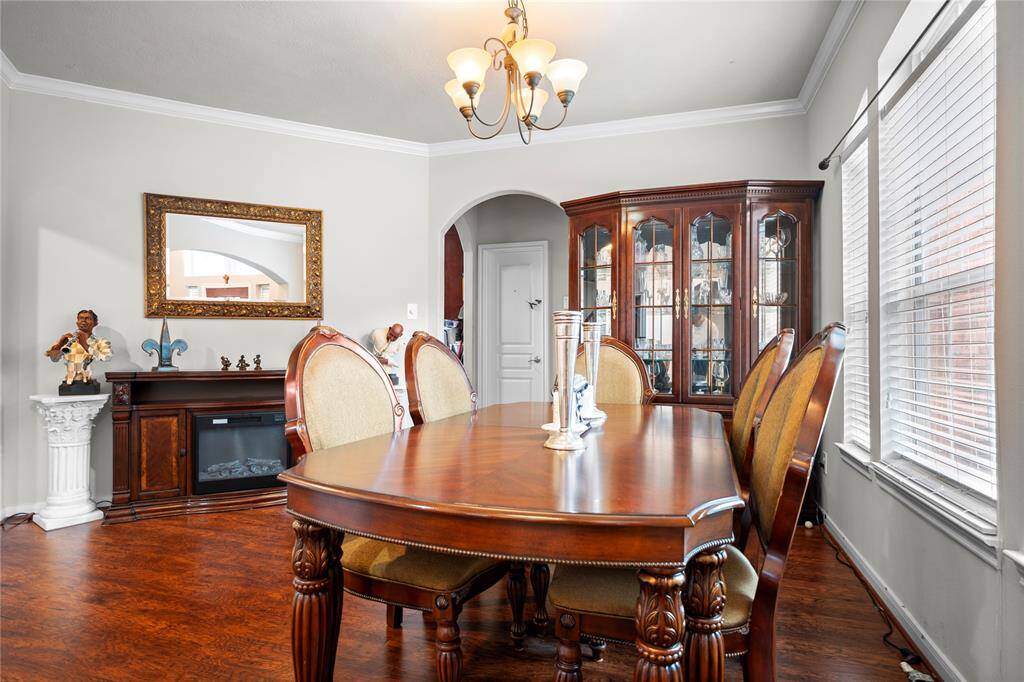 From the moment you step inside, you're welcomed by a beautifully positioned formal dining room just off the main entry—perfect for entertaining and making lasting first impressions.
