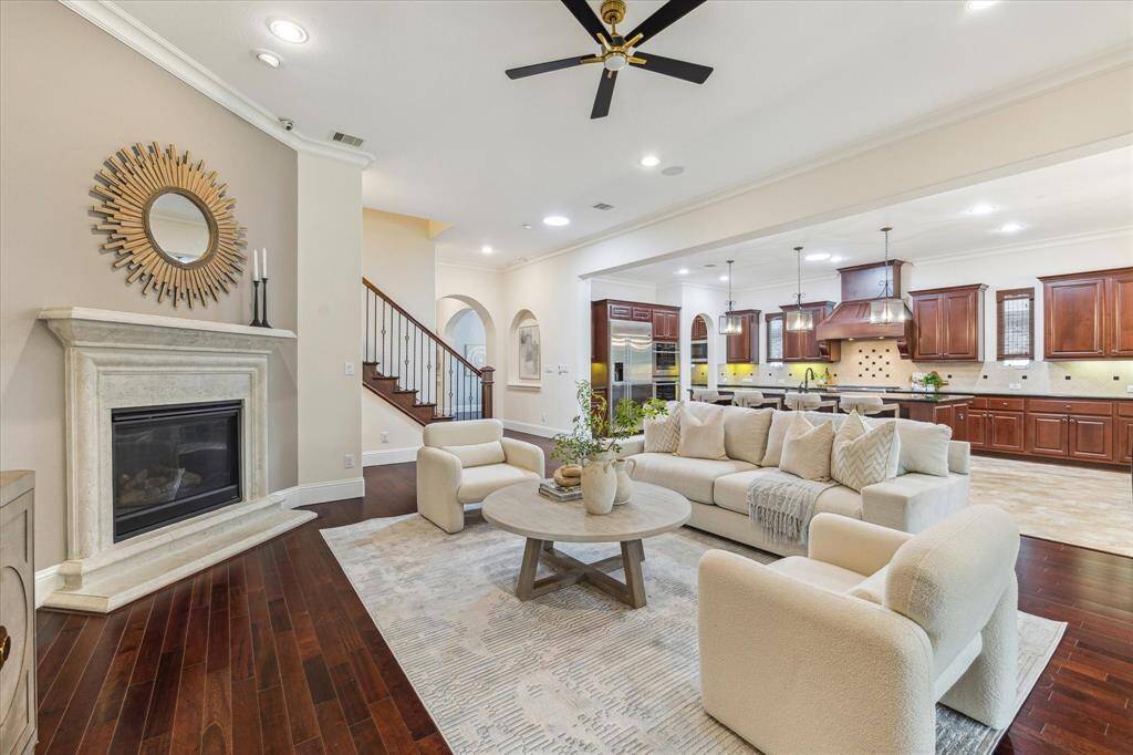 Recess lighting, neutral paint, with white ceilings and trim feel light, bright and airy. An accent tone on the fireplace wall highlights the cultured stone fireplace.