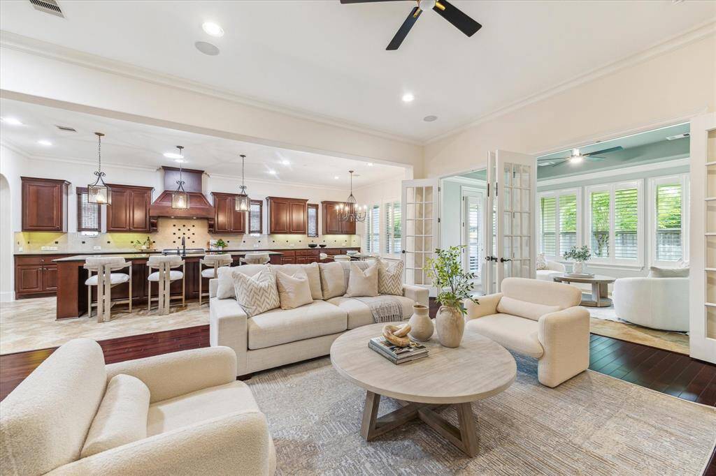 Flow from the kitchen, breakfast, family room and sunroom allows many to gather when entertaining.