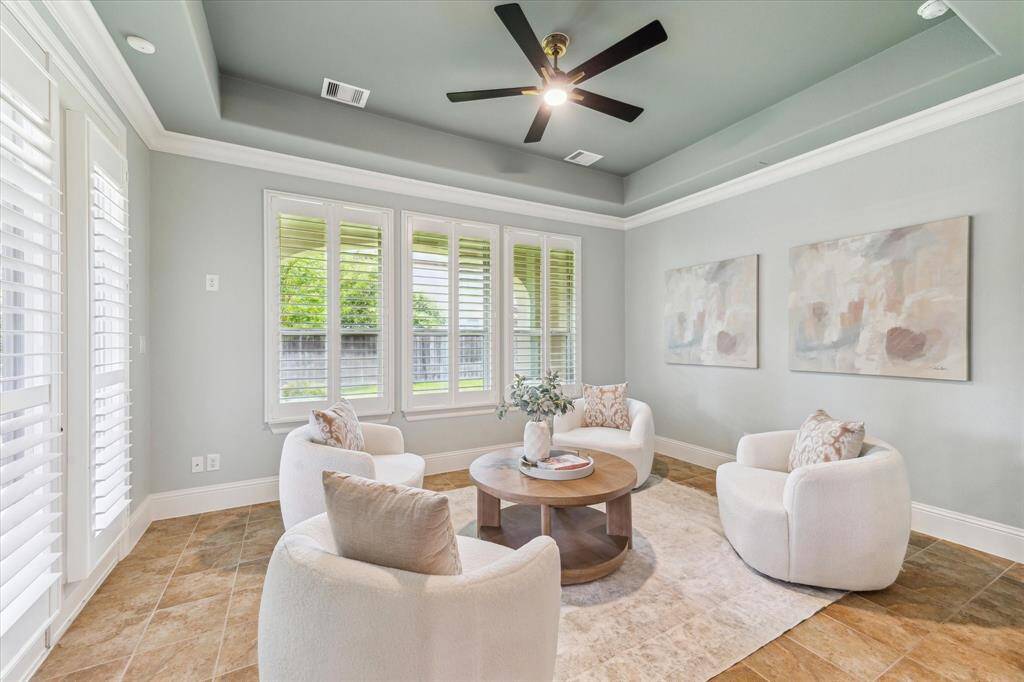 A bright sunroom painted in a fresh seafoam coloris the perfect space for relaxing or entertaining.