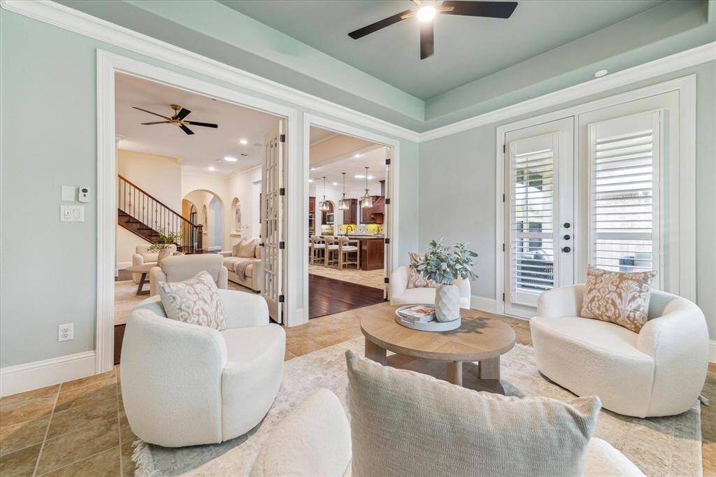 Double set of french doors between the family room. And another set exit to the back patio.