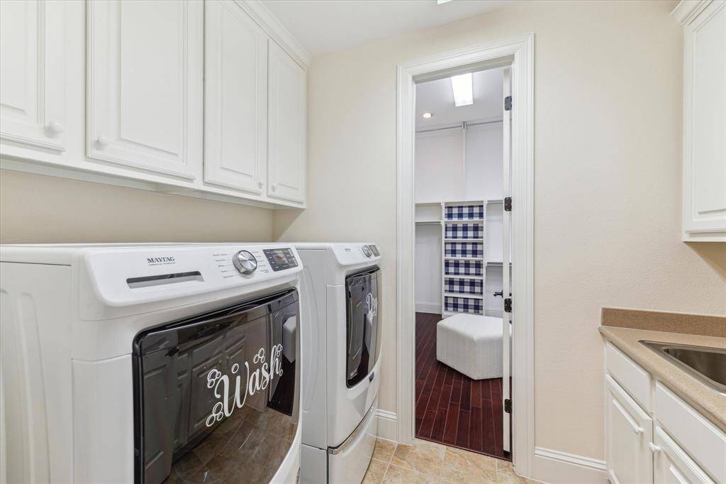 Laundry room has a passthru from the primary closet to a hallway near the secondary bedrooms. W/D convey.