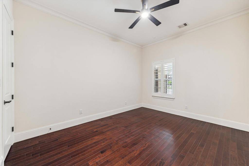 Bedroom 4 - Bedroom includes a private ensuite, wood flooring, new ceiling fan, shutters and neutral paint.