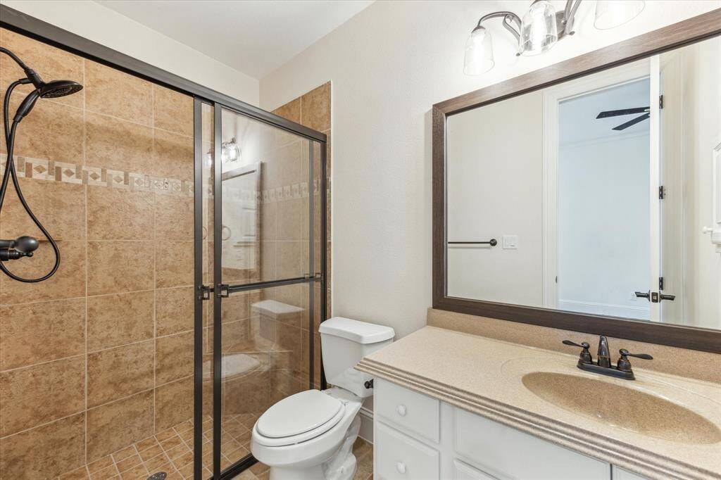 Secondary bath 2 - Stand up shower, framed mirrors, pull-out shower head, rubbed bronze fixtures, medicine cabinet.