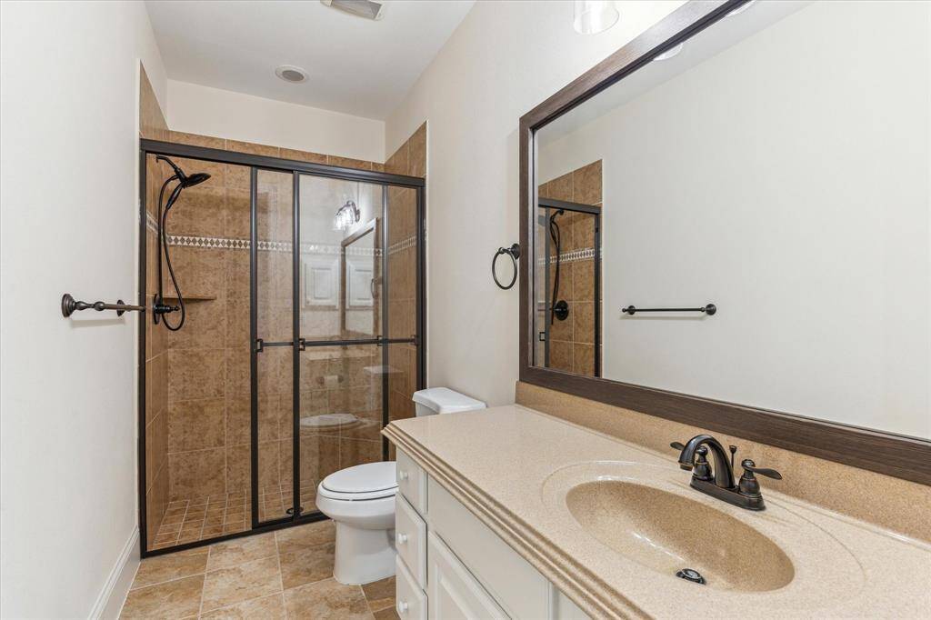 Secondary bath 4 - Stand up shower, framed mirrors, pull-out shower head, rubbed bronze fixtures, medicine cabinet..