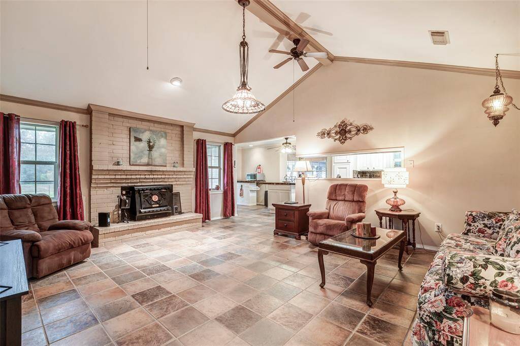 Family Room with wood burning stove and wood burning fireplace