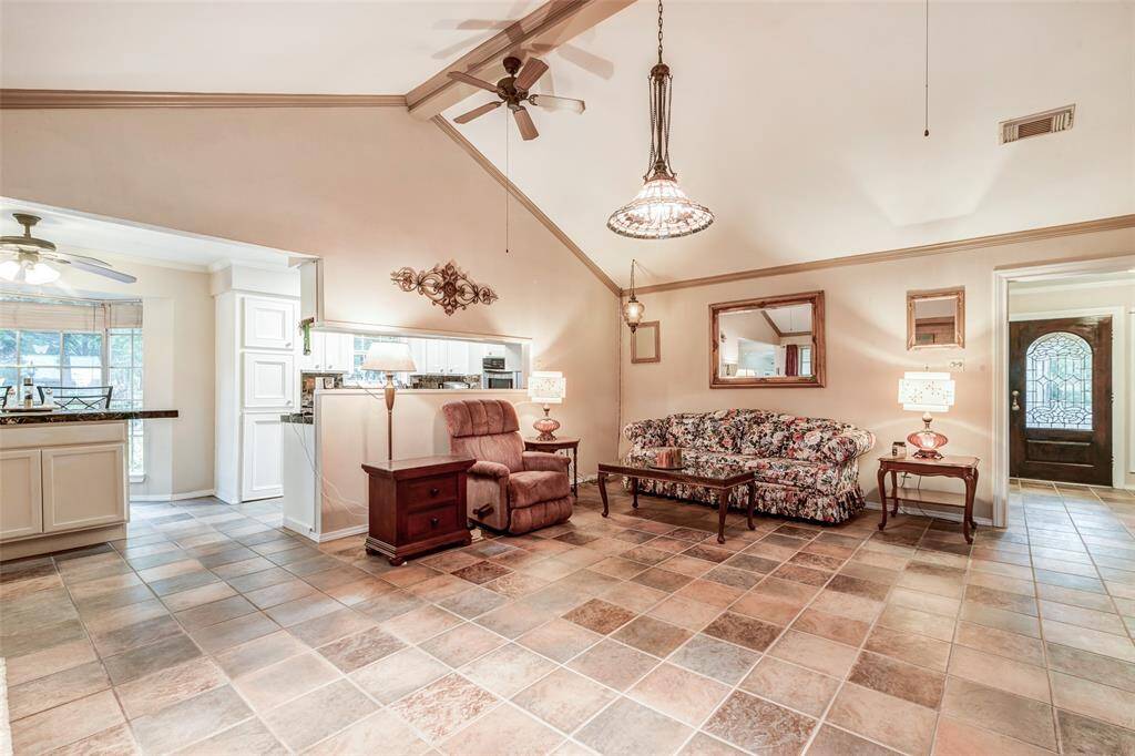 Family room looking into kitchen and foyer