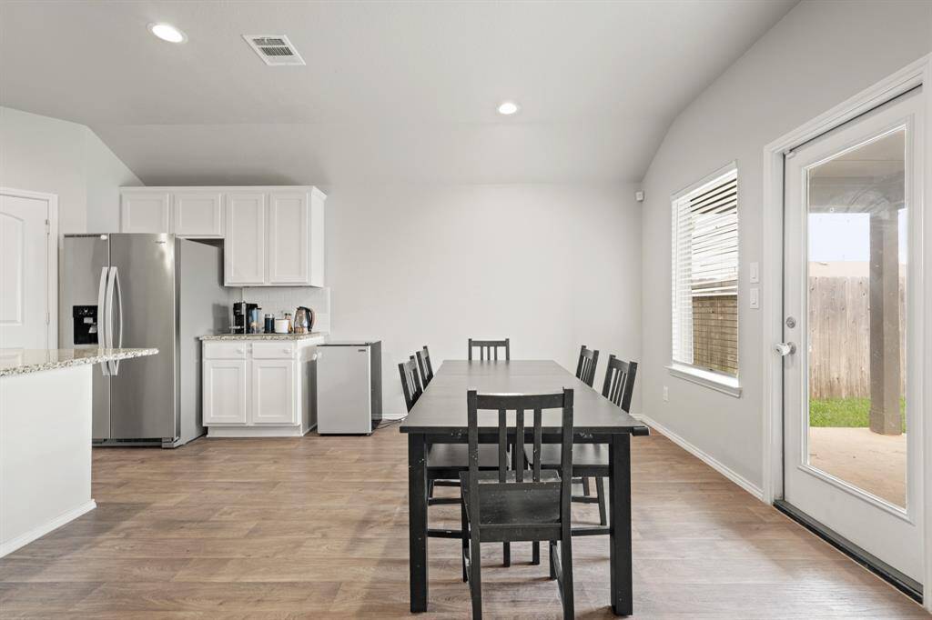 The dining area is perfectly situated off of the kitchen with direct access to the backyard for entertainment and food gatherings!