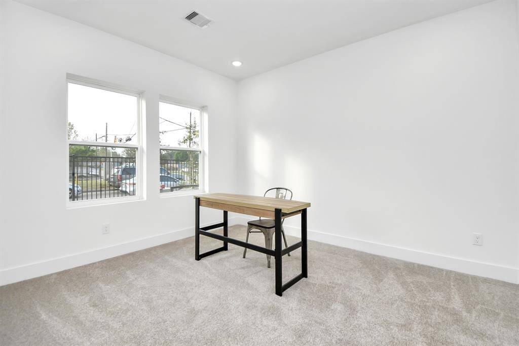 First bedroom on the first floor can be used as an office or guest room