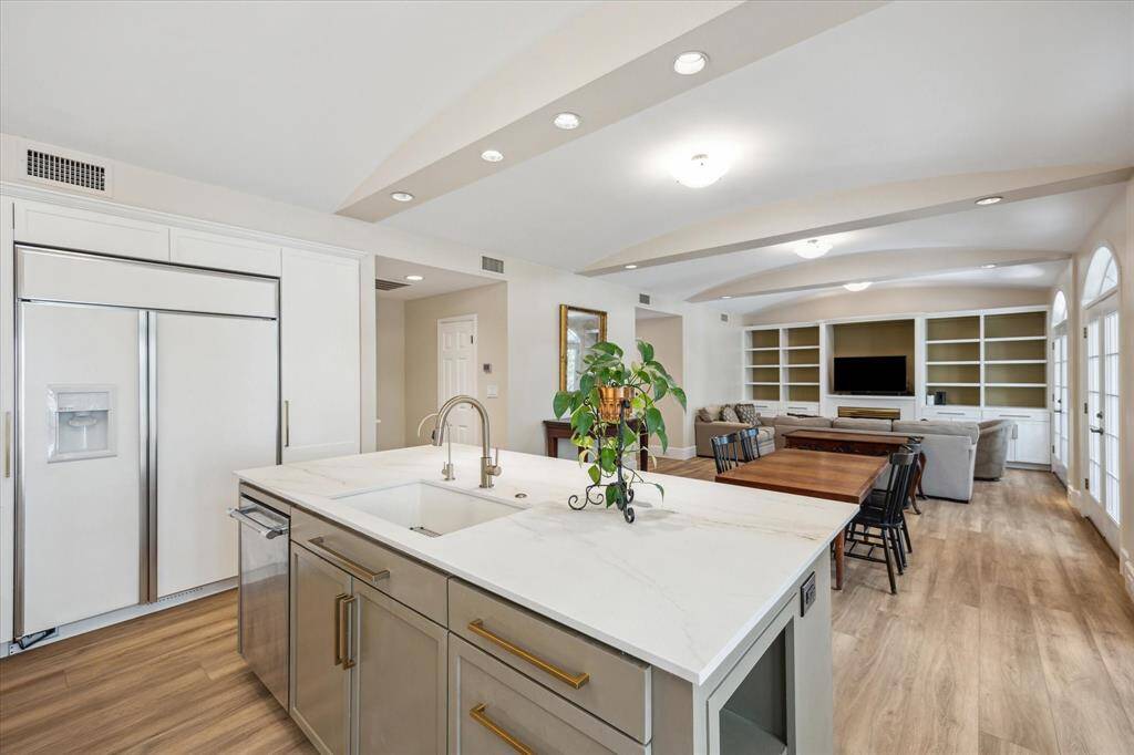 Kitchen boasts "state of the art" features. 48" GE Monogram refrigerator/freezer with 2 large pantries on either side